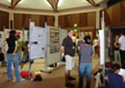 Students discussing Orientation poster